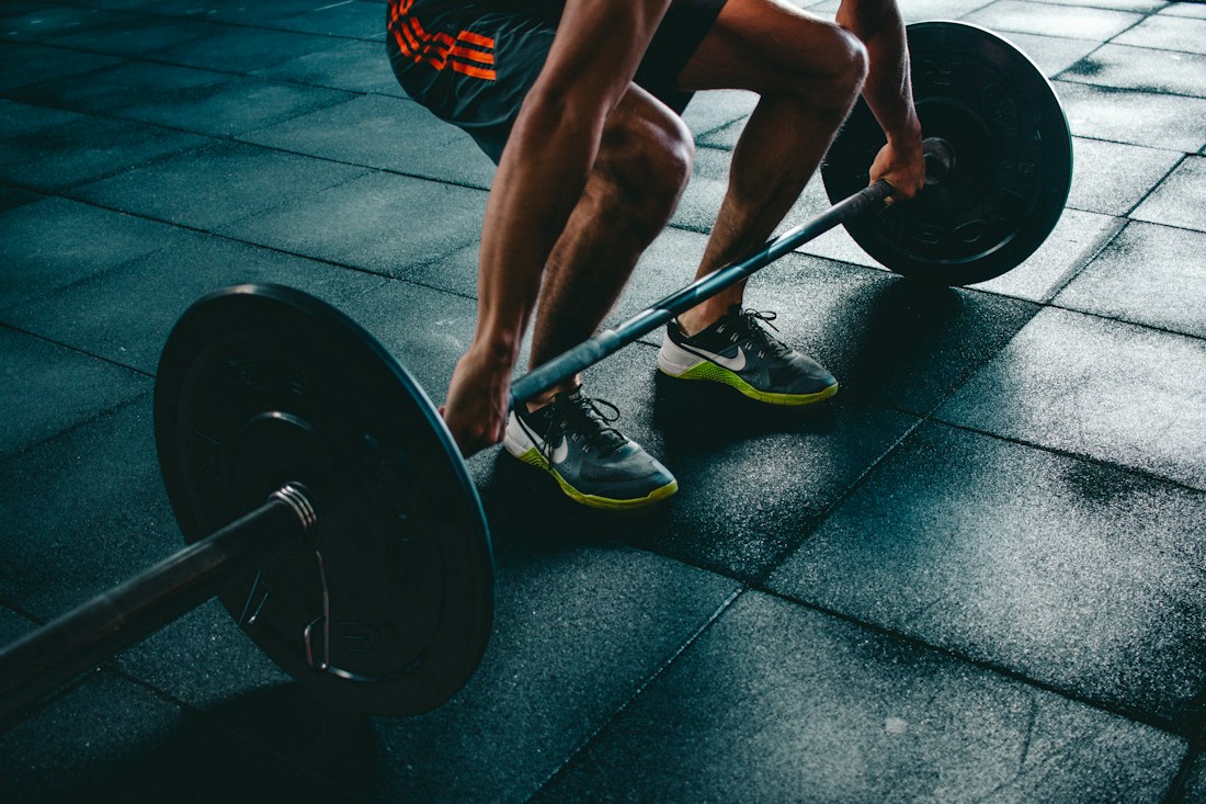 Athlete training with weights